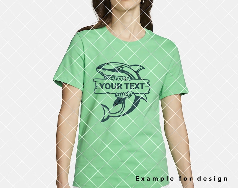 May include: A green t-shirt featuring a blue shark graphic and a wooden sign that reads "YOUR TEXT".