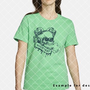 May include: A green t-shirt featuring a black and white skull graphic. The skull is wearing a crown and has two pipes coming out of its mouth. The text "YOUR TEXT" is written on a banner below the skull.