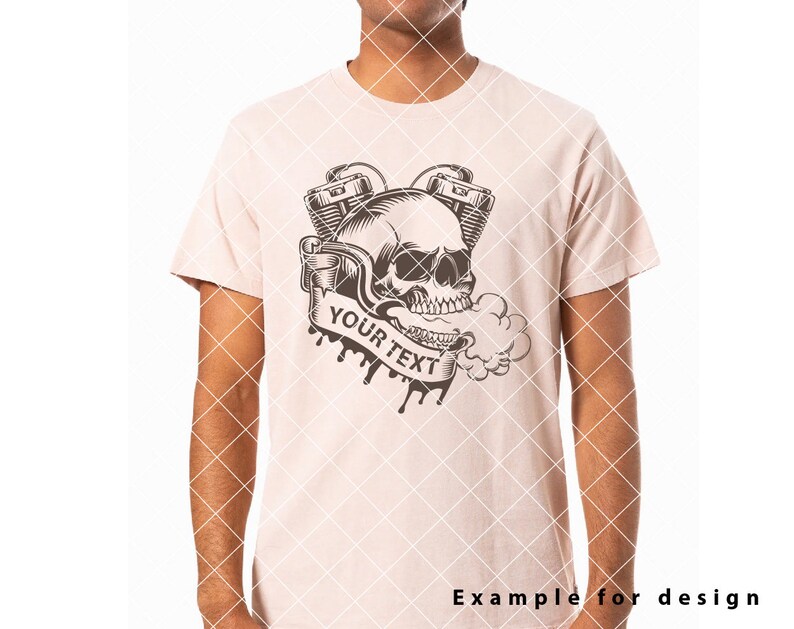 May include: A light pink t-shirt featuring a black and white graphic design of a skull with a smoking engine. The text "YOUR TEXT" is on a banner.