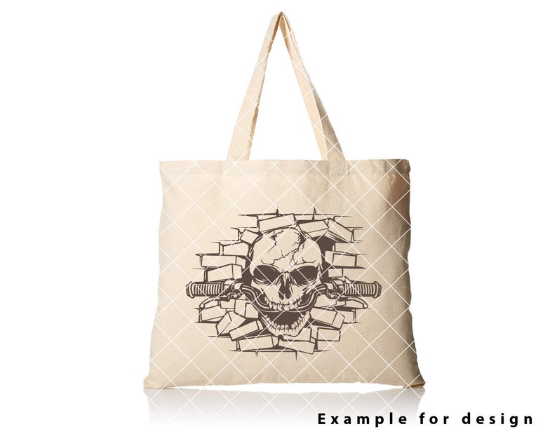 May include: A beige tote bag with a brown skull graphic breaking through a brick wall. The skull has a toothy grin and is holding a handlebar.