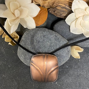 Copper Embossed Puff Pendant with Black Suede Cord