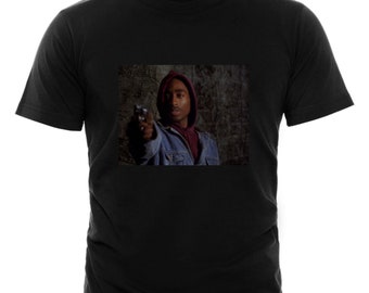 tupac holding a gun
