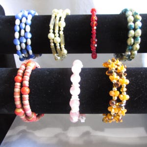 May include: A set of three ceramic mugs with a speckled, matte finish. The mugs are in shades of cream, light gray, and dark gray. Each mug has a simple, minimalist design, perfect for coffee or tea.