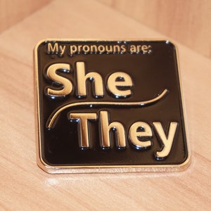 She/They Enamel Pronoun Pin - Large 40mm X 40mm