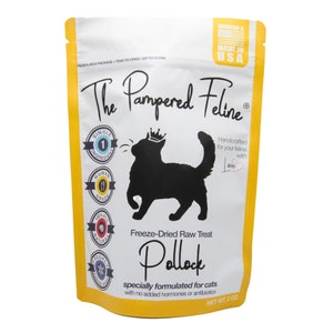 May include: A yellow and white pouch with a black silhouette of a cat. The pouch contains freeze-dried raw Pollock treats for cats. The text on the pouch reads "The Pampered Feline" and "Handcrafted for your feline with love".