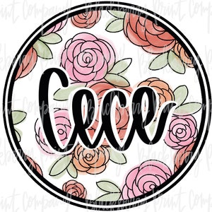 May include: A round, white background with a black outline and a floral pattern. The flowers are pink, red, and green. The word "Cece" is written in black cursive letters in the center of the circle.