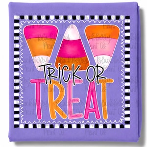 May include: A purple fleece blanket featuring a graphic of three candy corn pieces in pink, orange, and white. The design includes a black and white chequered border and the text "TRICK OR TREAT" in bold, colourful, stylised lettering.