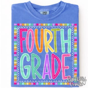 May include: A periwinkle blue t-shirt featuring a colorful graphic with the text FOURTH GRADE in multi-colored bubble letters. The design is enclosed in a scalloped border made of small, vibrant squares in various bright colors.