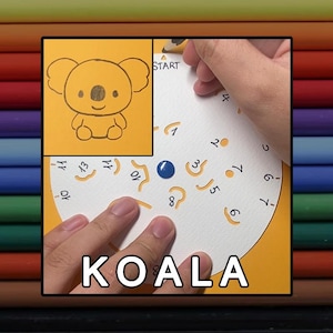 May include: A white circular paper guide with numbered cutouts and a blue centre dot, used for drawing a koala. The guide features the word START and numbers 1 through 13. An inset shows a completed line drawing of a koala on a yellow background.