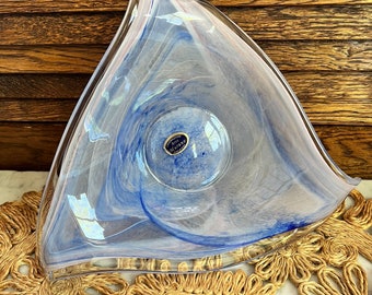 May include: A triangular glass bowl with a swirl design in shades of blue and white. The bowl is made by the Italian glassmaker, "Il Vetro".