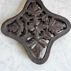 Footed Hand-Carved Wood Trivet – Vintage Dark Stain with Leaf Pattern