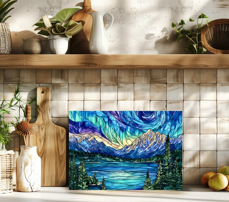 Decorative glass cutting board with night sky mountain art styled on kitchen counter