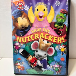 May include: A DVD case featuring the Nickelodeon show Wonder Pets! The cover art showcases a yellow duckling in a pink dress, a guinea pig, and a turtle. The title "Save the Nutcracker!" is prominently displayed with other characters and snowflakes.