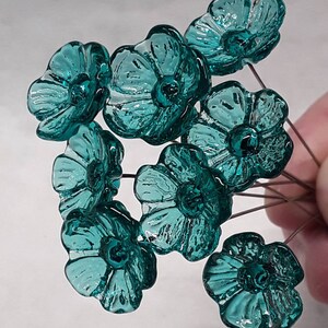 Glass flowers tiny miniature small glass flowers in light seagreen color approx half inch in diameter. Handmade lampwork glass by Sandy K Johnson Glassworks
curio, windowsill, Mothers Day, Valentines Day, gift, love, thinking of you, specialty gift