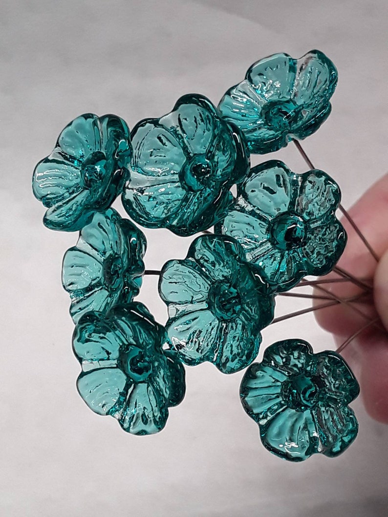 Glass flowers tiny miniature small glass flowers in light seagreen color approx half inch in diameter. Handmade lampwork glass by Sandy K Johnson Glassworks
curio, windowsill, Mothers Day, Valentines Day, gift, love, thinking of you, specialty gift