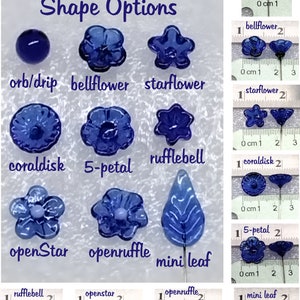 May include: A variety of glass flower shapes in blue, including orb, bellflower, starflower, coraldisk, 5-petal, rufflebell, openstar, openruffle, and mini leaf. The shapes are displayed on a white surface with a ruler for size reference.