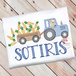 May include: A blue tractor with a bunny driver pulling a wagon full of carrots. The wagon is labeled with the name "SOTIRIS".