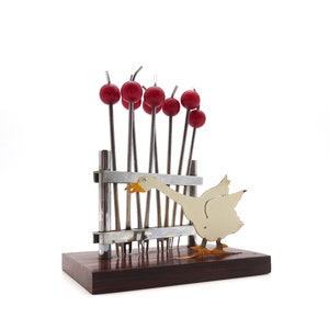 Beautiful art deco cherry bakelite cocktail picks sticks in enamel duck holder