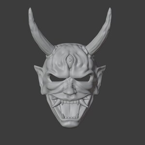 May include: A white, detailed, 3D printed Oni mask with horns, a third eye, and a fierce expression.