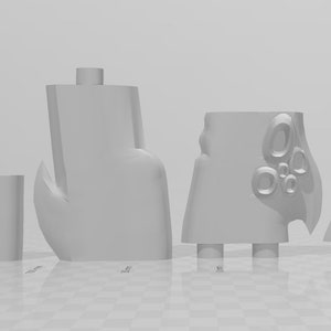 May include: Five 3D printed plastic pieces in white. The pieces are various shapes and sizes, including a fin, a claw, and a piece with a textured surface.