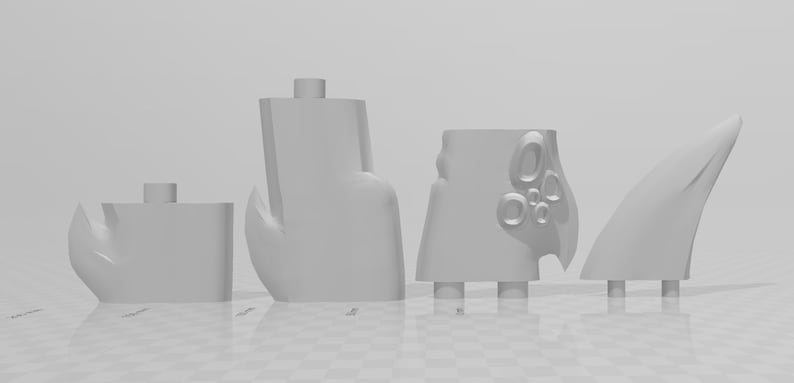 May include: Five 3D printed plastic pieces in white. The pieces are various shapes and sizes, including a fin, a claw, and a piece with a textured surface.