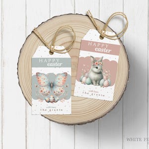 May include: Two pastel-colored Easter gift tags with a bunny and butterfly design. The tags are tied with twine and have the text "Happy Easter" and "with love, the grants".
