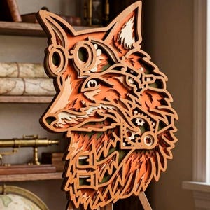 May include: A layered wooden fox sculpture with steampunk-inspired goggles and gears. The fox features shades of orange, brown, and cream, with intricate details and a three-legged stand. The artwork is displayed on a wooden surface.