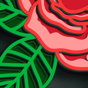May include: A layered paper art design featuring a red rose and green leaves. The rose has a light pink center with red outlines, and the leaves are green with dark green and black layers. The background is dark gray.