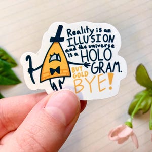 May include: A white sticker with a cartoon character wearing a yellow triangle hat. The character is holding a stick and has a bow tie. The text on the sticker reads "Reality is an ILLUSION and the universe is a HOLOGRAM. BUY GOLD BYE!"