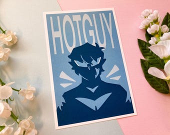 May include: A blue and white print with the text "HOTGUY" in white letters. The print features a dark blue silhouette of a person with short hair and a serious expression.