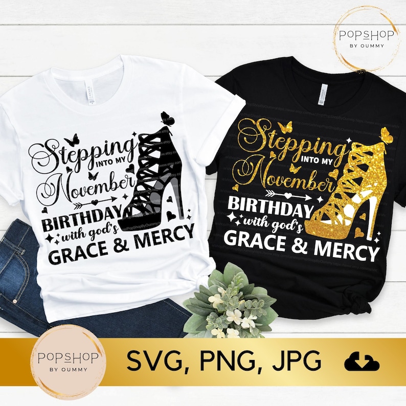 May include: Two t-shirt designs with the text "Stepping into my November Birthday with God's Grace & Mercy" and a high heel shoe graphic. One shirt is white with a black shoe and the other is black with a gold shoe.