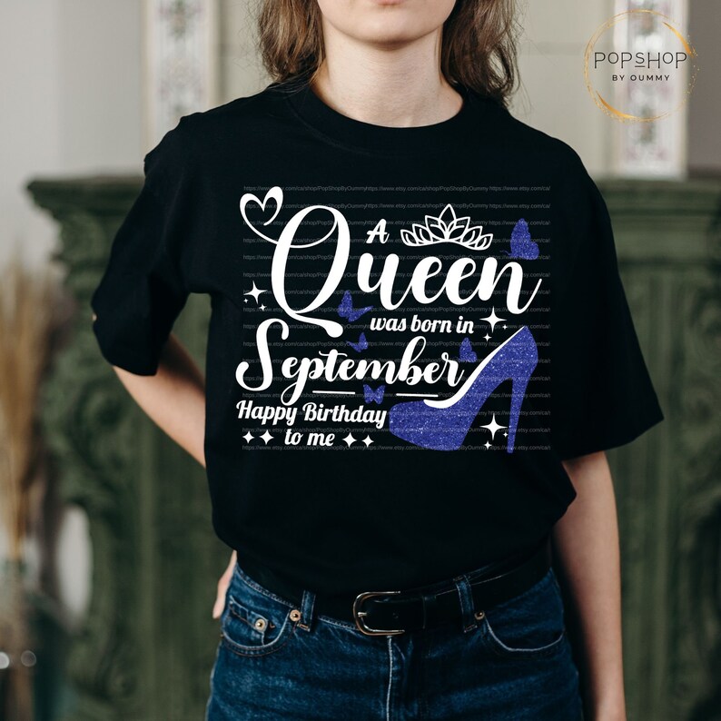 May include: Black t-shirt with white text that reads "A Queen was born in September Happy Birthday to me". The text is surrounded by glitter and butterflies. A blue glitter high heel shoe is also on the shirt.