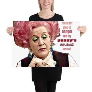 May include: A poster featuring a stylized portrait of a woman with pink hair and green eyeshadow. The text reads, "The least sign of danger and my pussy's hair stands on end."