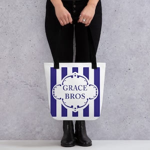 May include: A white tote bag with blue stripes and a white logo that says "GRACE BROS" in a decorative font.