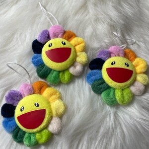 SaveALL Murakami classic rainbow color fake sunflowers keychain brooch pin  kitchen wall decor plush toy cute smile great for decoration phones  backpacks jeans jackets and more 2.7 inches diameter : Clothing, Shoes &  Jewelry 