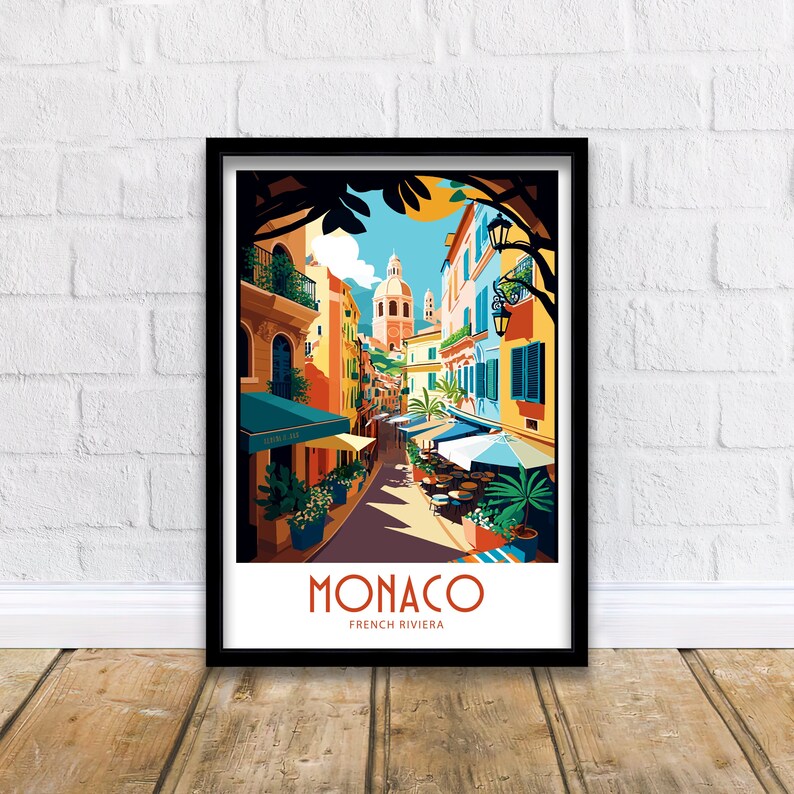 May include: A colorful illustration of a street scene in Monaco, French Riviera. The image features a narrow street lined with colorful buildings, palm trees, and outdoor cafes. The text "MONACO FRENCH RIVIERA" is displayed at the bottom of the image.