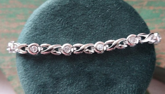 Vintage sterling silver CZ hugs and kisses bracel… - image 1