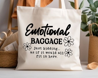 May include: White canvas tote bag with black text that reads "Emotional Baggage... just kidding... as if it would all fit in here."  The text is surrounded by black daisy flowers.