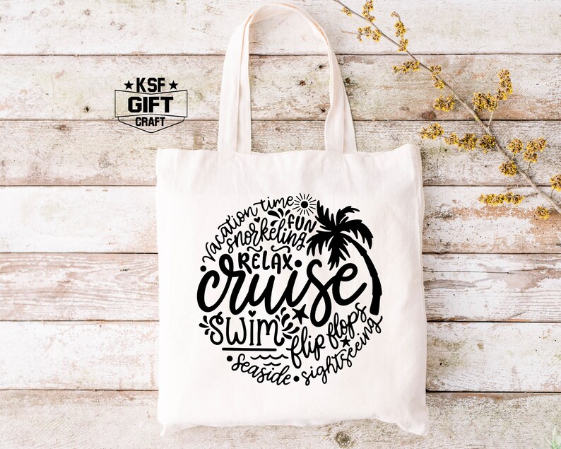 May include: White canvas tote bag with a black design that says "vacation time, snorkeling, fun, relax, cruise, swim, flip flops, seaside, sightseeing". The design is in a circle with a palm tree in the center.