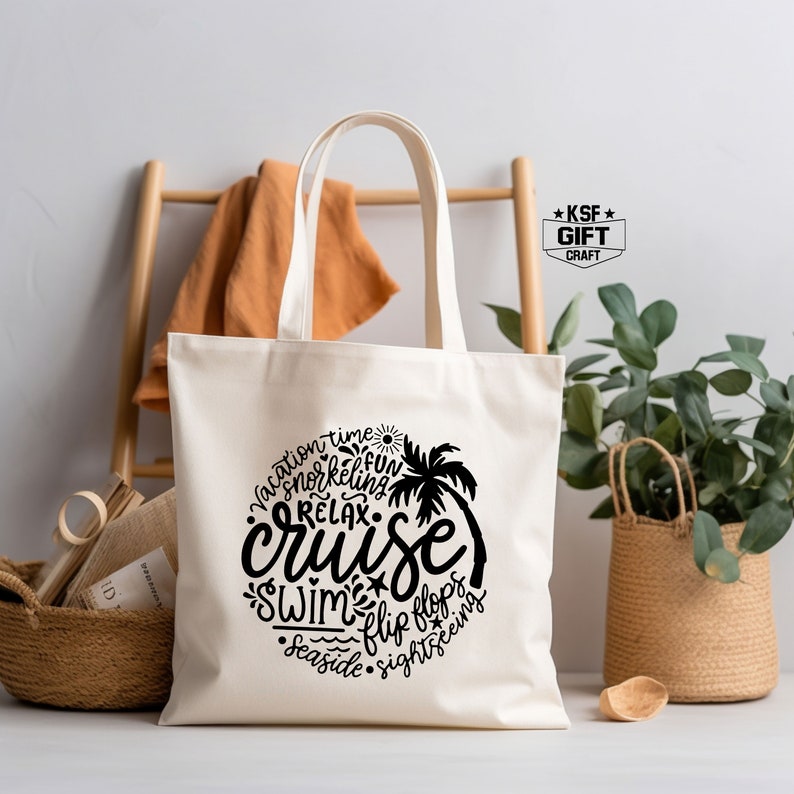 May include: White canvas tote bag with black text that reads "vacation time snorkeling fun relax cruise swim flip flops seaside sightseeing". The text is arranged in a circle around a palm tree graphic.