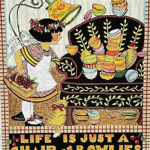 May include: A colorful needlepoint design featuring a girl in a white dress and a floral headband standing next to a chair piled high with colorful bowls. The text "Life is just a chair of bowlies" is at the bottom of the design.