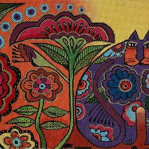 May include: A vibrant needlepoint canvas depicting a purple cat with orange features, decorated with floral patterns. The background is a mix of orange, red, and yellow, with additional floral and leaf motifs. The artwork is a colourful, decorative piece.