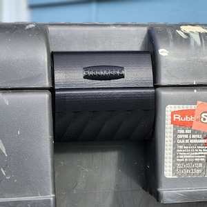 May include: A black toolbox with a black latch. The toolbox has the word "Rubbermaid" printed on the side. The toolbox dimensions are 20.2 x 13.7 x 13 inches.