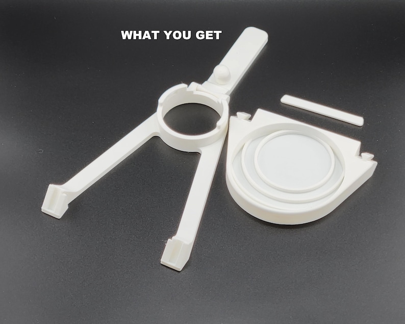 May include: White plastic 3D printed parts for a DIY project. The parts include a ring, a base with a handle, and a flat piece.