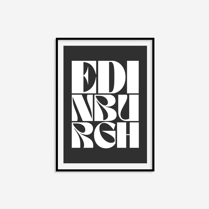 May include: Black and white typography print of the word "EDINBURGH" in a bold, stylized font. The print is framed in a black frame.