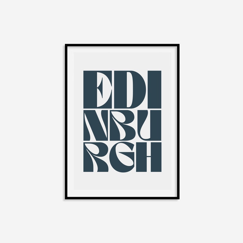 May include: A framed print with the word "EDINBURGH" in a bold, stylized font. The letters are in a dark blue color against a white background.