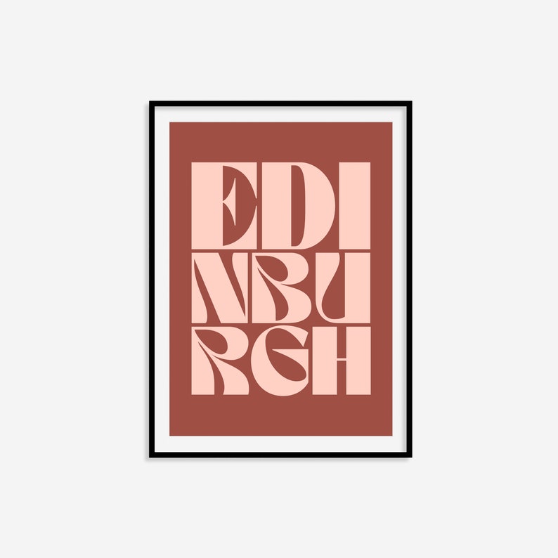 May include: A framed print with a red background and the word "EDINBURGH" in pink letters. The letters are stylized and overlap each other.