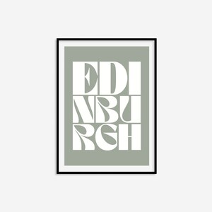 May include: A sage green framed print with the word "EDINBURGH" in white stylized lettering.