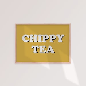 May include: A framed print with a yellow background and white text that reads "CHIPPYY TEA".