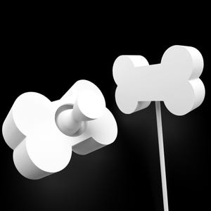May include: Two white, 3D-rendered dog bone-shaped objects against a black background. One bone is on a white stem, and the other is a bottle stopper. The objects are simple and modern.